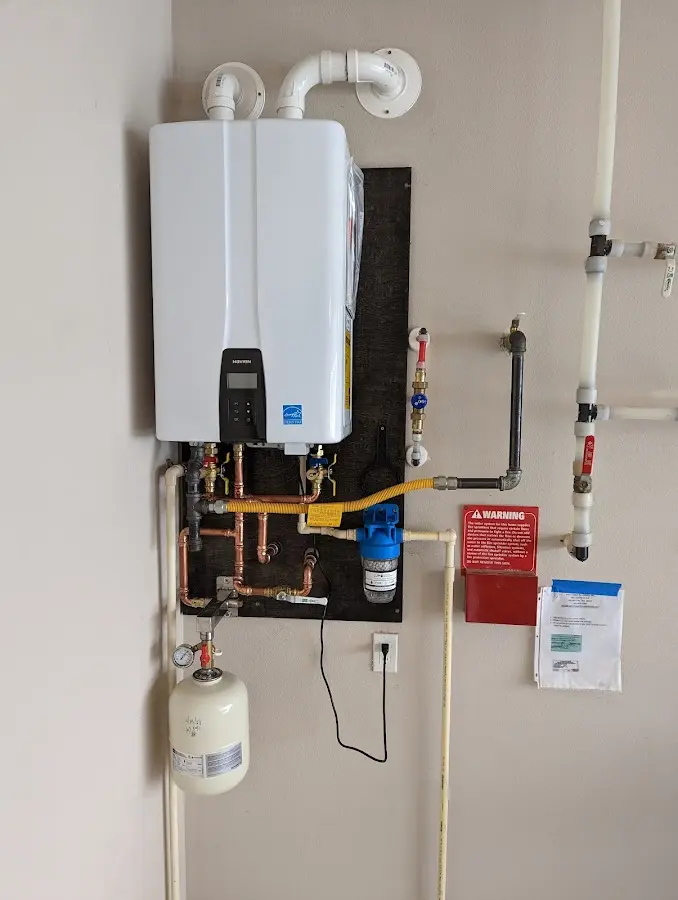 Professional plumber installing copper piping in a St. James City home